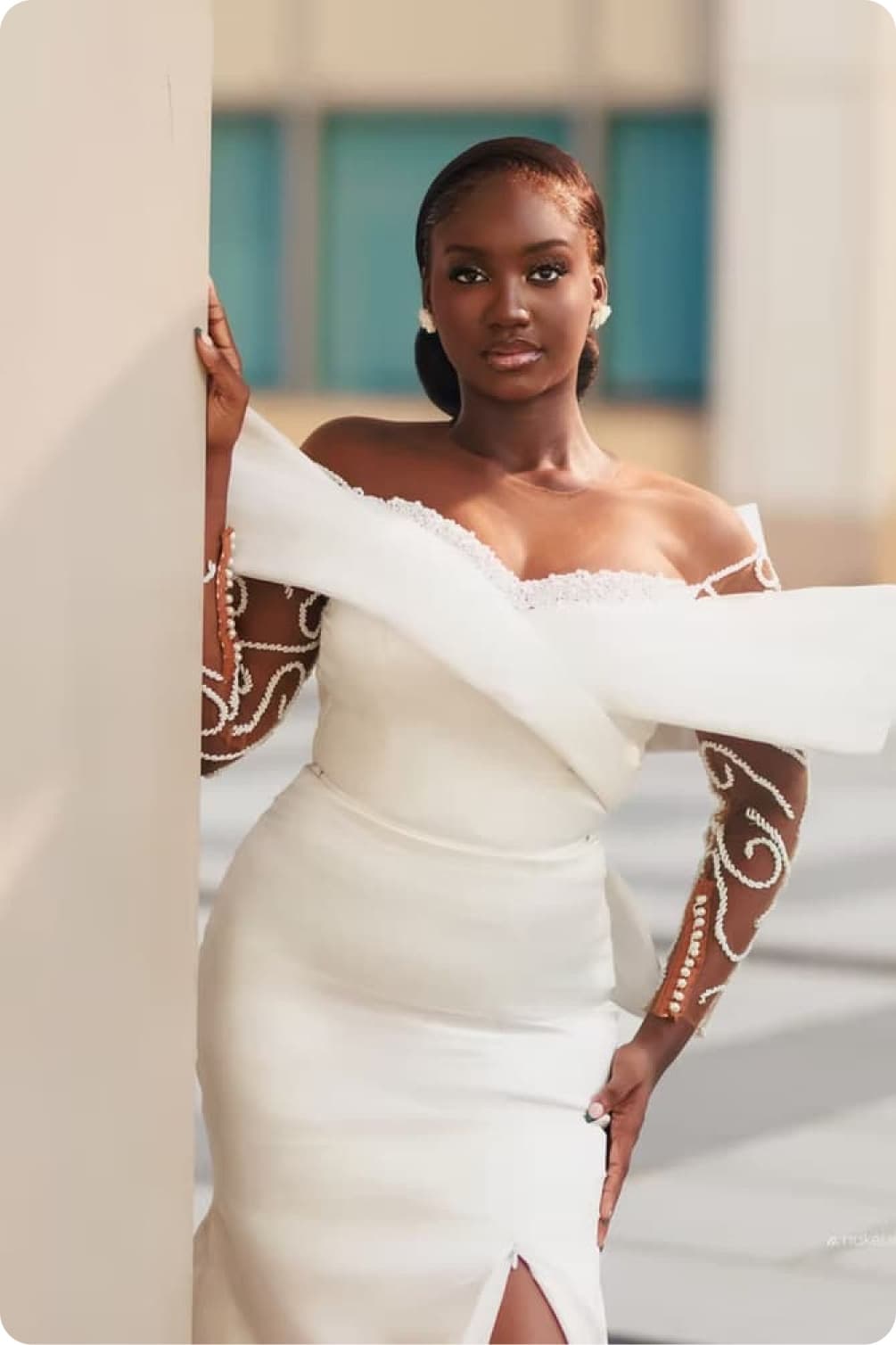 Model wearing a structured white bridal gown from the Signature collection